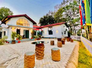 a house with a courtyard with a table in front of it at Urban Villa in Guwahati
