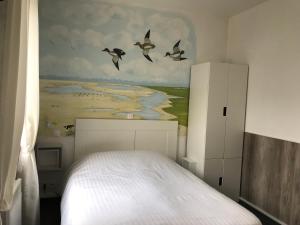 Postel nebo postele na pokoji v ubytování Logis - Le Neptune Hôtel & Restaurant