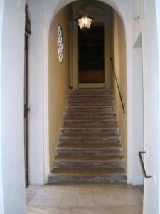 a hallway with stairs in a building with a light at Urbana 33 in Rome