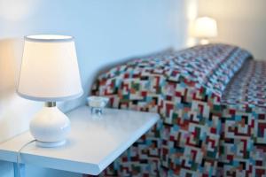 A bed or beds in a room at SARI CASA VACANZE