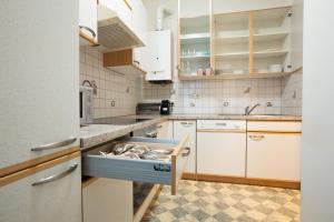 A kitchen or kitchenette at Two bedrooms family nice apartment Még 20 kép