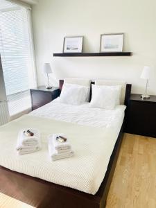 En eller flere senge i et værelse på Apartament Golden Tulip