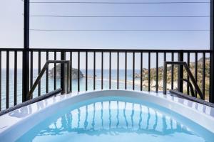 a plunge pool on a balcony with a view of the ocean at il azzurri in Nishiizu