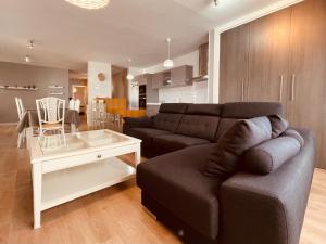 a living room with a couch and a table at Apartamento Cerro del Aire in Las Negras