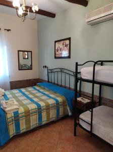 Кровать или кровати в номере Il Vigneto "Cottage"