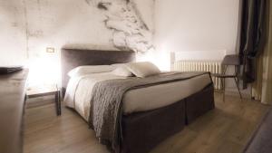 Postel nebo postele na pokoji v ubytování AgriHotel Villa Ambra
