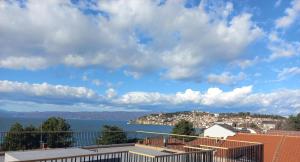 a view of the water and a city at RIBAR APARTMENTS in Ohrid