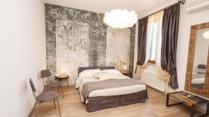 Postel nebo postele na pokoji v ubytování AgriHotel Villa Ambra