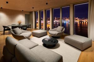 a living room with a couch and chairs and a table at Hotel Ambasador in Split