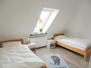 Postel nebo postele na pokoji v ubytování Ferienwohnung Dons