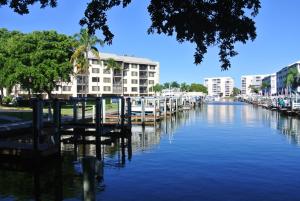 a view of a river with buildings in the background at Freds Santa Maria Harbour Resort Condo in Fort Myers Beach