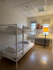 Postel nebo postele na pokoji v ubytování Baron's Hostel