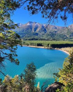 a view of a lake with mountains in the background at San Martín de los Andes Depto para 4 Pax in San Martín de los Andes