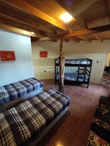 Кровать или кровати в номере Cabañas Larache