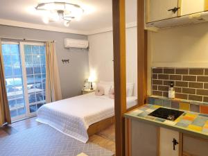 Voodi või voodid majutusasutuse Olive Vanilla Pension toas