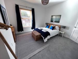 a bedroom with a bed and a window at House in Manchester in Manchester
