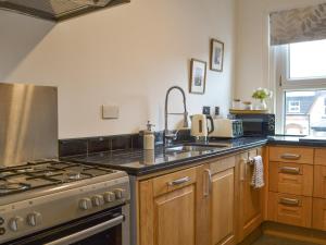 Kuchyň nebo kuchyňský kout v ubytování Brincliffe Loft