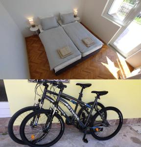 a bike parked next to a bed in a room at Oleas Stari Grad Hvar 2 Min To Center Ocean Bus Supermarket in Stari Grad