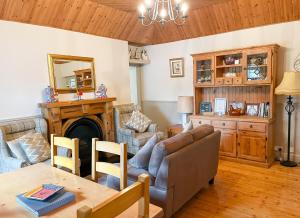 a living room with a couch and a table at Clydagh Lodge in Castlebar