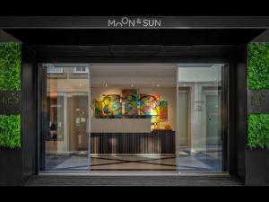a window of a building with a display in it at Hotel Moon & Sun Porto in Porto