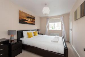 a bedroom with a large bed and a window at Spenny View in Spennymoor