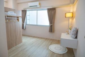 Postel nebo postele na pokoji v ubytování 2BR minimal mu-ji style 130SQM ~