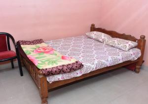 Postel nebo postele na pokoji v ubytování Kaveri Homestay