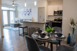 a kitchen and living room with a table and chairs at Modern and Spacious King Size Retreat in Concord
