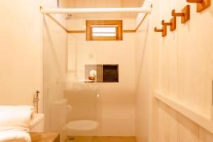 a bathroom with a shower and a toilet at CASA na PRAIA DA BARRINHA Frente Mar in Barrinha