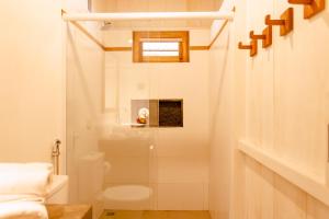 a bathroom with a shower and a toilet at CASA na PRAIA DA BARRINHA Frente Mar in Barrinha +77 photos