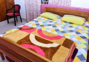 Postel nebo postele na pokoji v ubytování Kaveri Homestay