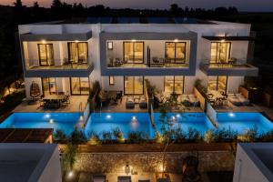 an aerial view of a house with a swimming pool at Sezian Boutique Homes and Villas in Preveza