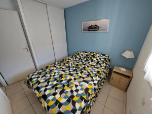 מיטה או מיטות בחדר ב-Magnifique Vue sur Mer