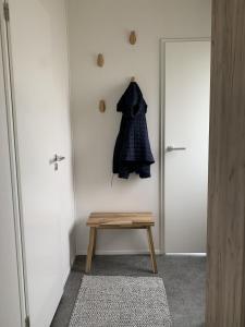a coat hanging on a wall next to a door at NV 1220 - Beach Resort Nieuwvliet Bad in Nieuwvliet