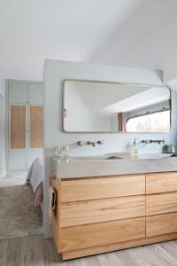 a bathroom with a sink and a mirror at Escale Sur Seine in Paris