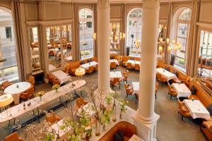 an overhead view of a restaurant with tables and chairs at Corinthia London in London