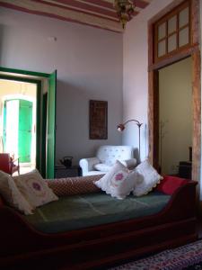 A bed or beds in a room at Casa de João