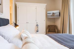 Postel nebo postele na pokoji v ubytování Strandvilla Apartment Meeresglück