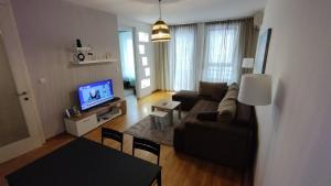 TV a/nebo společenská místnost v ubytování Apartment Belville, Suncokret 26