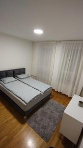 Postel nebo postele na pokoji v ubytování Apartment Belville, Suncokret 26