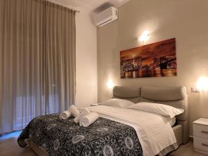 a bedroom with a large bed and a large window at Dream Guest House in Pisa