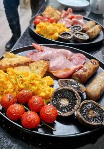 two plates of breakfast foods on a table at The Elan Valley Hotel in Rhayader