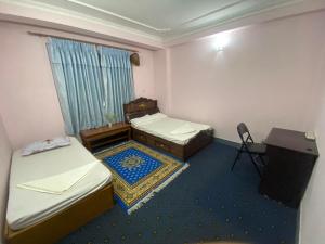 Postel nebo postele na pokoji v ubytování Himalayan Vacation Home