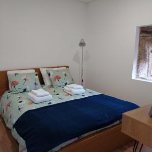 Ένα ή περισσότερα κρεβάτια σε δωμάτιο στο Douro Feels Like Home
