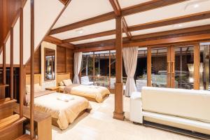 Postel nebo postele na pokoji v ubytování Sienna Resort