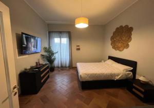 A television and/or entertainment centre at StarHome San Paolo