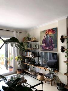 a living room filled with lots of plants at Cozy House in La Manga Club in Atamaría