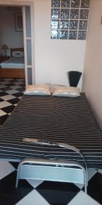 a large bed in a room with at Residência Mendonça in Faial