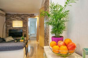 a bowl of fruit on a table in a living room at Spacious 2BD, fully equipped for a relaxing holiday in Split