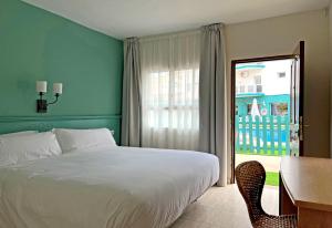 Postel nebo postele na pokoji v ubytování Moon Dreams Fuengirola